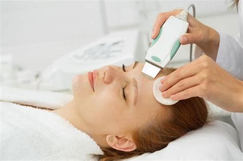Beautiful Woman Getting Ultrasound Facial Cleansing At Beauty Cl Stock