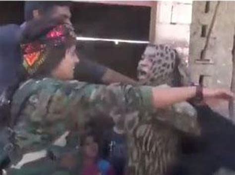 woman rips off black robes after being freed from isis in raqqa the independent the independent