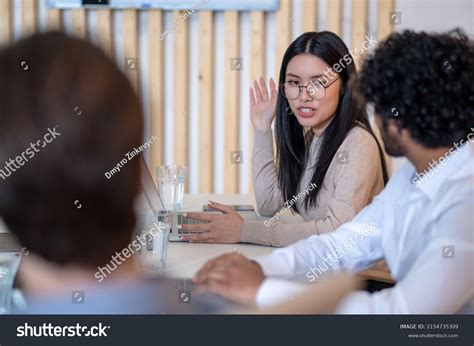 Office Employee Talking Her Coworkers Table Stock Photo 2154735309