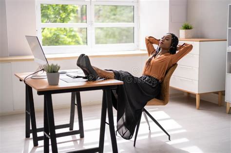 Relaxed Businesswoman Sitting Feet Up At Desk Stock Photo Image Of