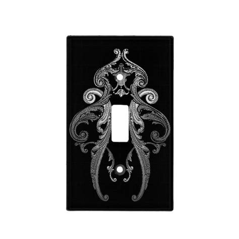 An Ornate Light Switch Plate Cover In Black And White