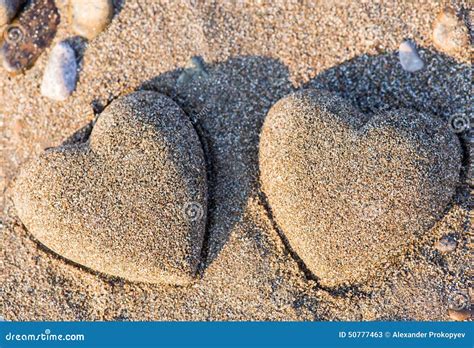 Two Sand Heart Shape In The Sand By The Sea Stock Image Image Of