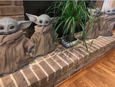 Photo Baby Yoda Cardboard Cutouts By The Fireplace