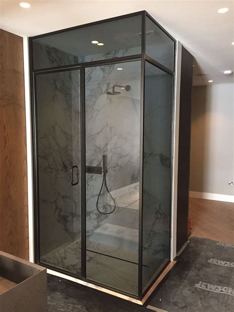 we love this black framed shower enclosure with a dark smoked glass finish really un… luxury