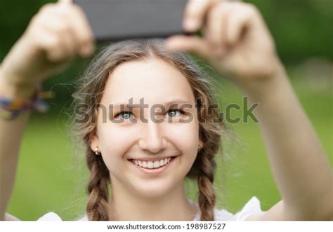 Teenage Girl Taking Selfie On Smartphone Stock Photo 198987527