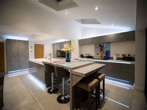 A Breakfast Bar Designed With A Large Island In A Gloss Handleless Kitchen