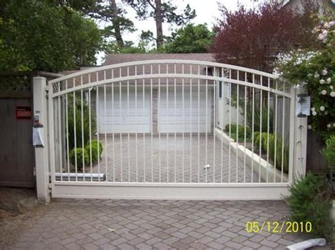 Many modern wrought iron gates are actually not wrought iron at all, but powder coated steel made in the traditional wrought iron style. 332 Arched Gates at www.ccoigateandfence.com Driveway ...
