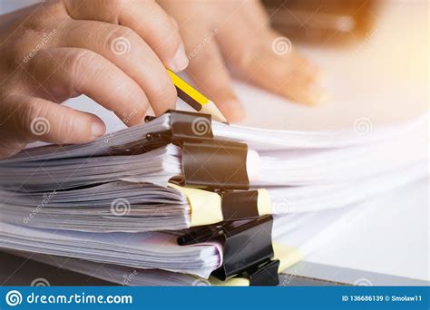 Businessman Hands Searching Unfinished Documents Stacks Of Paper Files