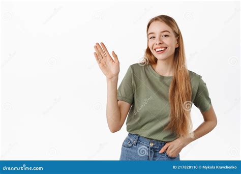 Friendly Blond Girl Waving Hand To Say Hello Young Woman Smiling And Saying Hi Greeting You