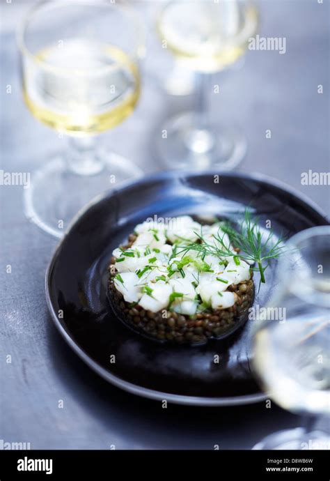 Scallop Tartare And Lentils With Aniseed Stock Photo Alamy