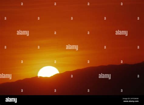Sunrise Over Hills Stock Photo Alamy