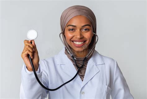 Portraif Of Black Islamic Female Doctor In Hijab Posing With