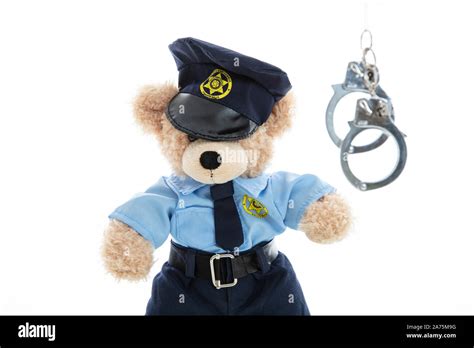 Police And Arrest Concept Cute Teddy Bear In Police Officer Uniform And Handcuffs Isolated