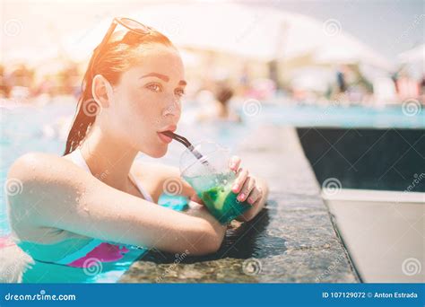 Brunette Girl With Cocktails Relaxing In Swimming Pool Woman In Bikini
