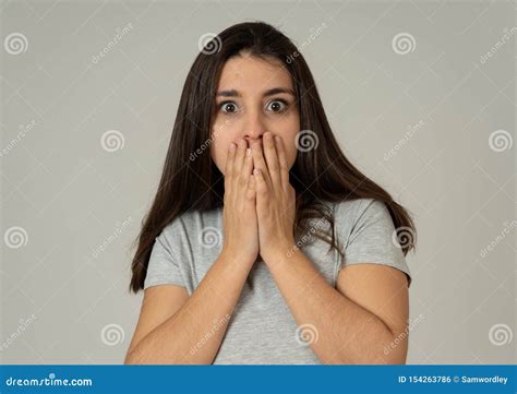 Portrait Of A Young Attractive Woman Looking Scared And Shocked Human