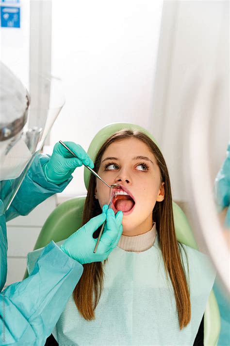 Dentist Working On A Patient In Dental Office Pordejan Ristovski