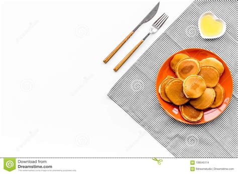 Pile Of Homemade Pancakes On Bright Plate On White Background Top View