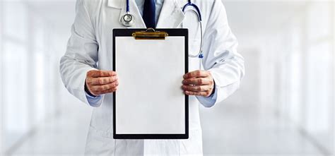 Male Doctor With The Blank Clipboard In The Hospital Stock Photo