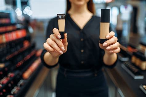 Premium Photo Female Seller Shows Cosmetics In The Makeup Shop Woman In Beauty Store Make Up