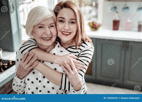 Adult Mother And Daughter Smiling And Feeling Happy While Hugging Stock Image Image Of Aged