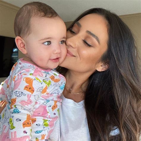 shay mitchell is teaching her 8 month old about activism motherly
