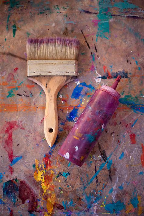 Overhead View Of A Stained Paint Brush And Bottle Of Paint Del