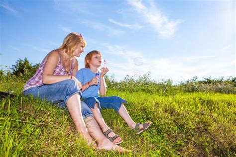 Mother And Son Blowing Bubbles Stock Photo Image Of Casual Leisure
