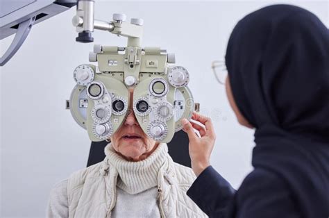 Eye Exam Vision And Senior Woman With Optometrist In Clinic For