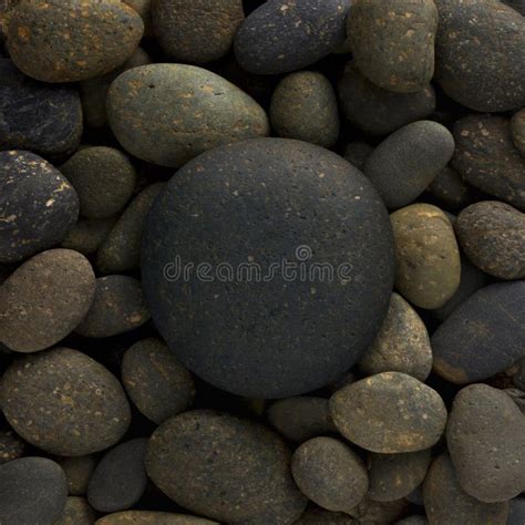 Round Circle Shape Of Big Sea Stone Laid On A Pile Of Nature Pebbles Or
