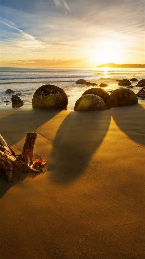 Download Wallpaper 1080x1920 New Zealand Ocean Sunrise Rocks