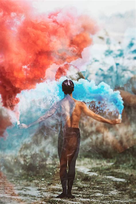 Double Exposurefrom Behindballet Dancer With Two Colorful Smoke Bombs