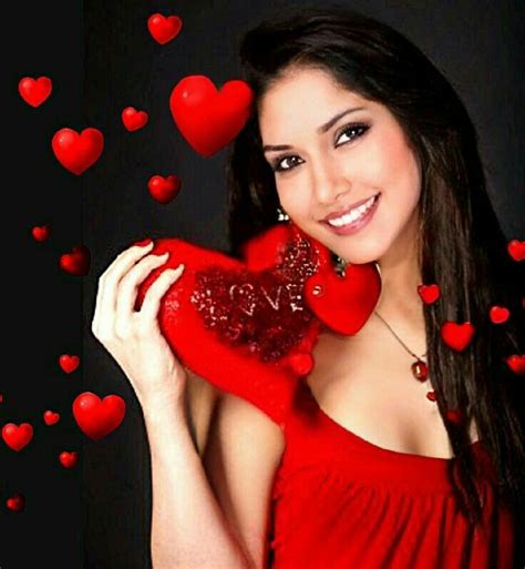 A Beautiful Woman Holding A Red Heart In Her Hands