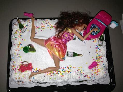 A Birthday Cake With A Doll Laying On It And Confetti Sprinkles