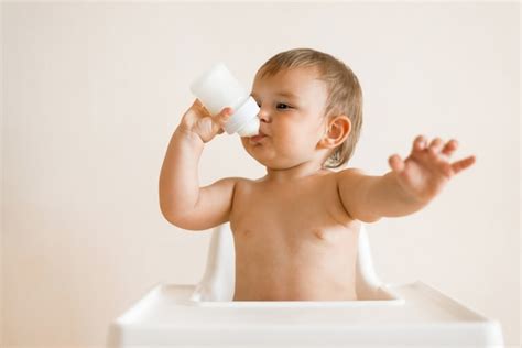 Baby Drinking Milk From Bottle Photo Free Download