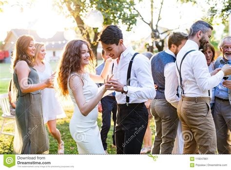 Guests Dancing At Wedding Reception Outside In The Backyard. Stock Image - Image of event, inlaw ...