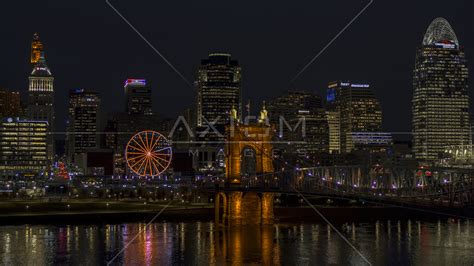 Ferris Wheel Roebling Bridge And City Skyline At Night Downtown