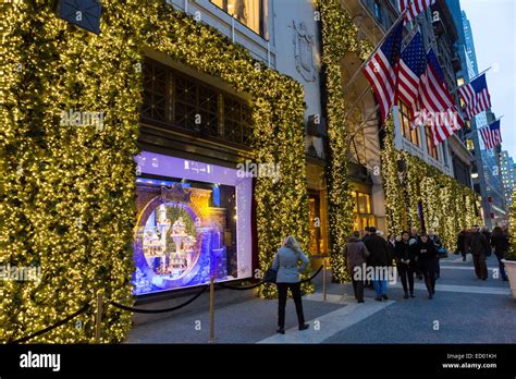 Tourists View The Christmas Window Holiday Display At Lord And Taylor