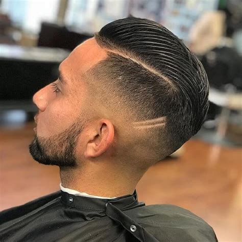 This is a comb over haircut (parted particularly on one side of the head) and pushed into one direction. Top 30 Best Comb Over Fade Haircuts | Comb Over Fade ...
