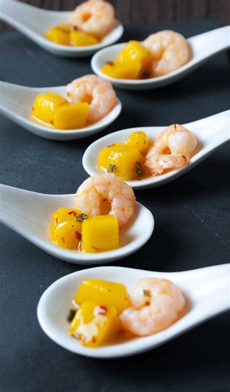 Classic shrimp cocktail is easy to make and will be a hit at your next party. Saturday Afternoon Platter - Prawn and Mango Spoons | Prawns appetizers, Sweet and spicy shrimp ...