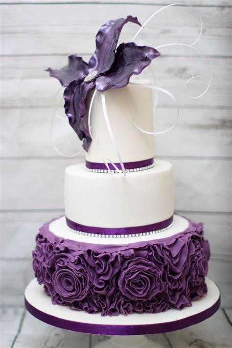They can be 3 tiered, 2 tiered or even just a cake pedestal. 3 Tier cadbury's purple birthday cake. Ruffle roses and ...