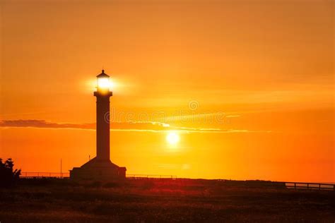 Lighthouse Searchlight Beam At Sunset Stock Photo Image Of Storm