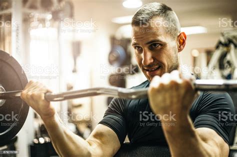 Handsome Muscular Male Model With Perfect Body Doing Biceps Exercise