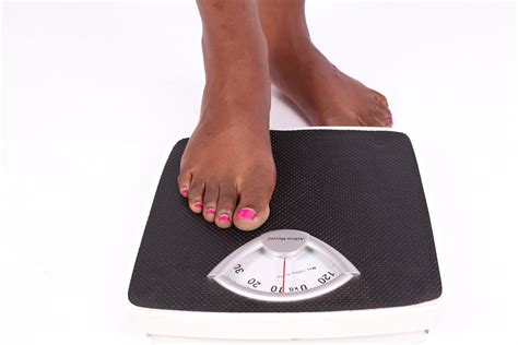 Woman Ready To Measure Weight On Weigh Scale
