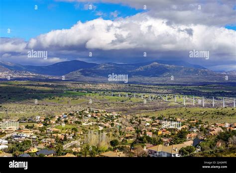 Aerial View Green Mountain Landscape With Dark Clouds And Villages With