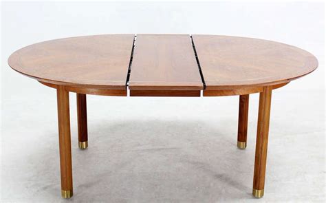 Featuring richly grained, gleaming teak and smooth, clean lines characteristic of classic danish design. Baker Mid-Century Modern Walnut Oval Dining Table with One ...