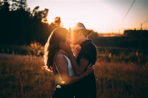 Man And Woman Kissing During Sunset Photo Free Dating Image On Unsplash
