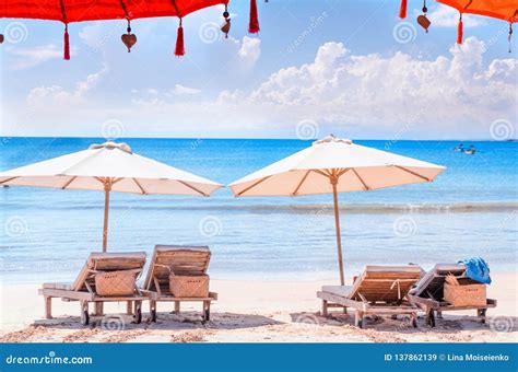 Chairs At Beach Sun Lounger And Umbrella At Bali Shore Stock Image