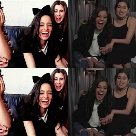 Two Women Are Laughing And One Is Holding Her Hand Up