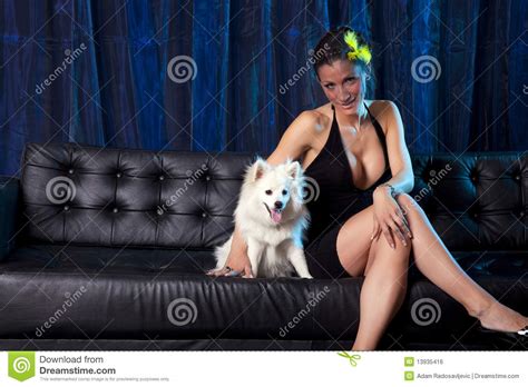 Sexy Woman In Black Dres With White Dog Royalty Free Stock