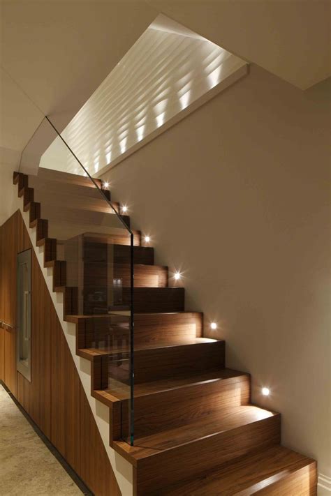 The Stairs Are Made Of Wood And Have Lights On Them